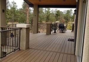 Composite decking laid out with divider boards. A deck cover with tongue and groove vaulted ceiling.