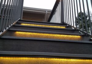 Composite deck stairs with LED strip lights added to step risers.