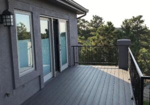 New composite deck with metal panel railing system.