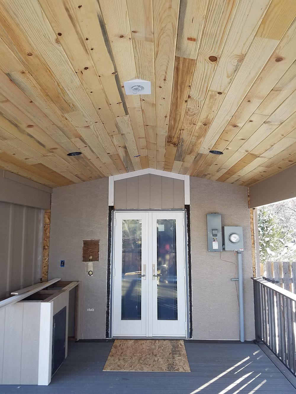 Tongue and groove pine ceiling for a gabled deck cover