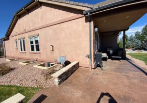 This picture shows the covered patio before we added glass walls and doors to make a 3-season room.