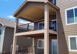 This shows a gabled deck cover with tongue and groove pine ceiling over a composite deck.