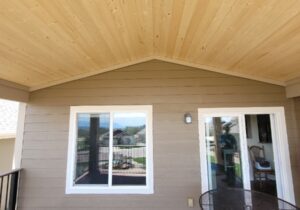 This shows a closer look at the vaulted, tongue and groove pine ceiling over the deck.