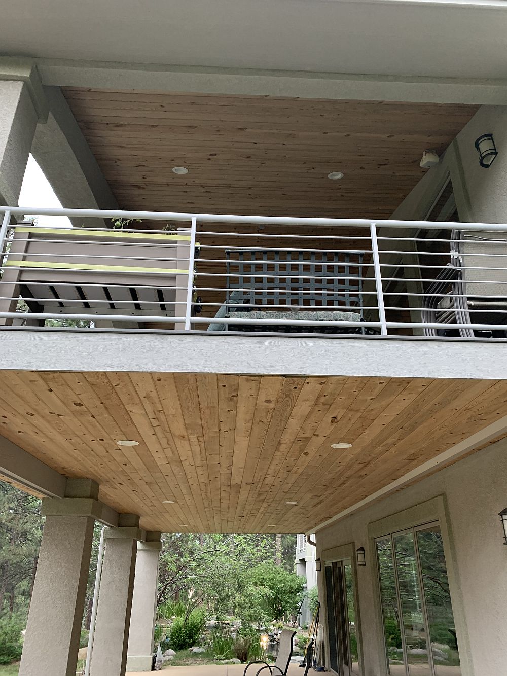 Steel framed deck with gabled deck cover and dry space below.