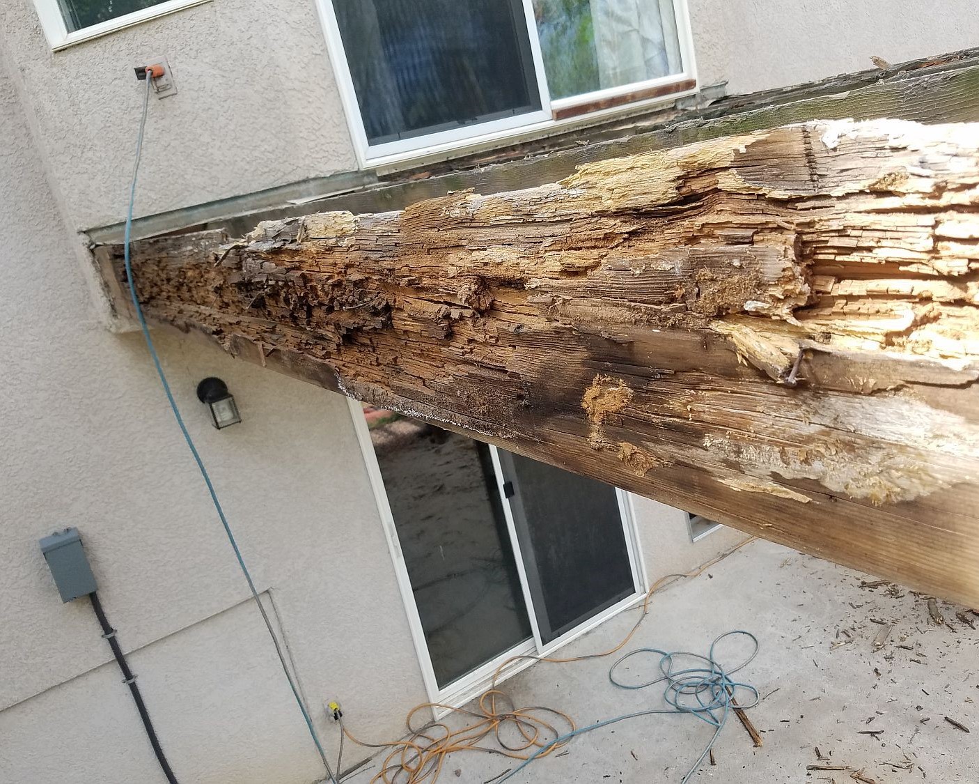Extensive brown rot damage on a beam from a wood deck