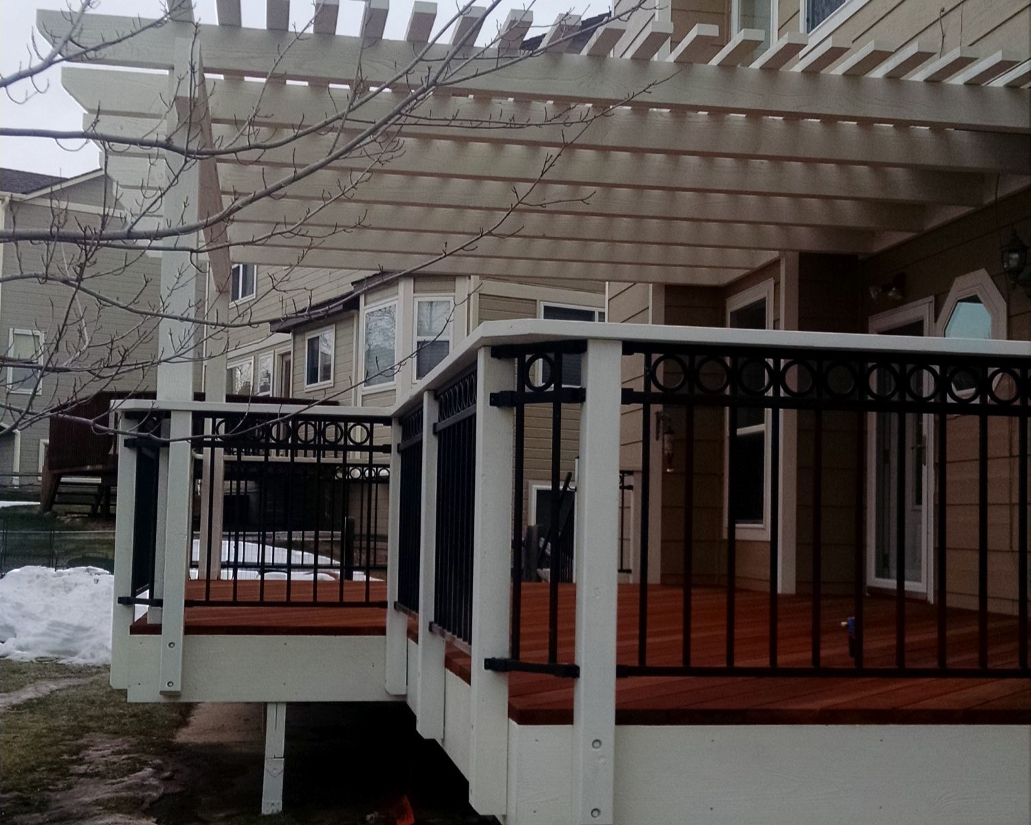 Redwood deck with Cedar pergola. Metal railing with ring top accent panel