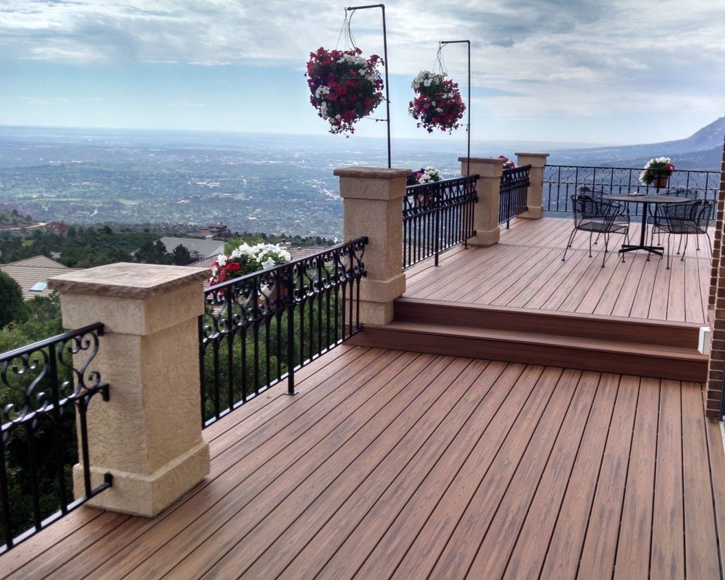 Multi-level composite deck with custom-designed and built wrought iron railing.