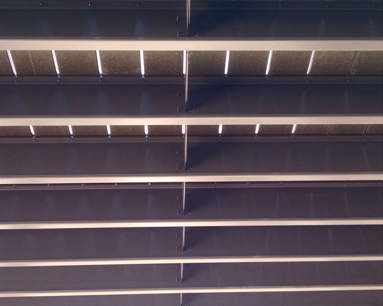 Powder coated steel deck framing as seen from below