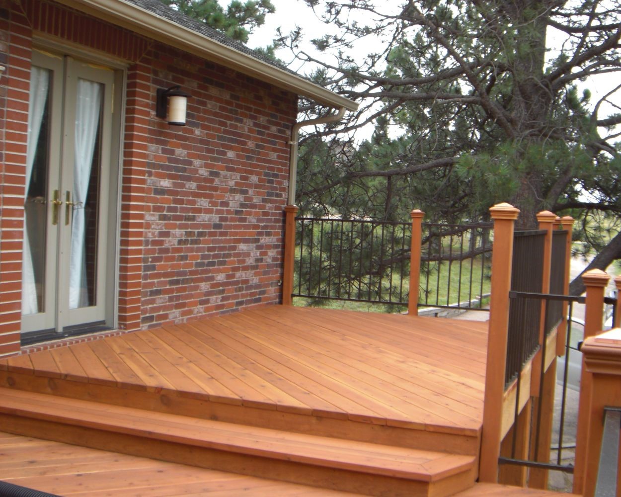 A redwood deck with a single 12'wide closed step between two deck levels.