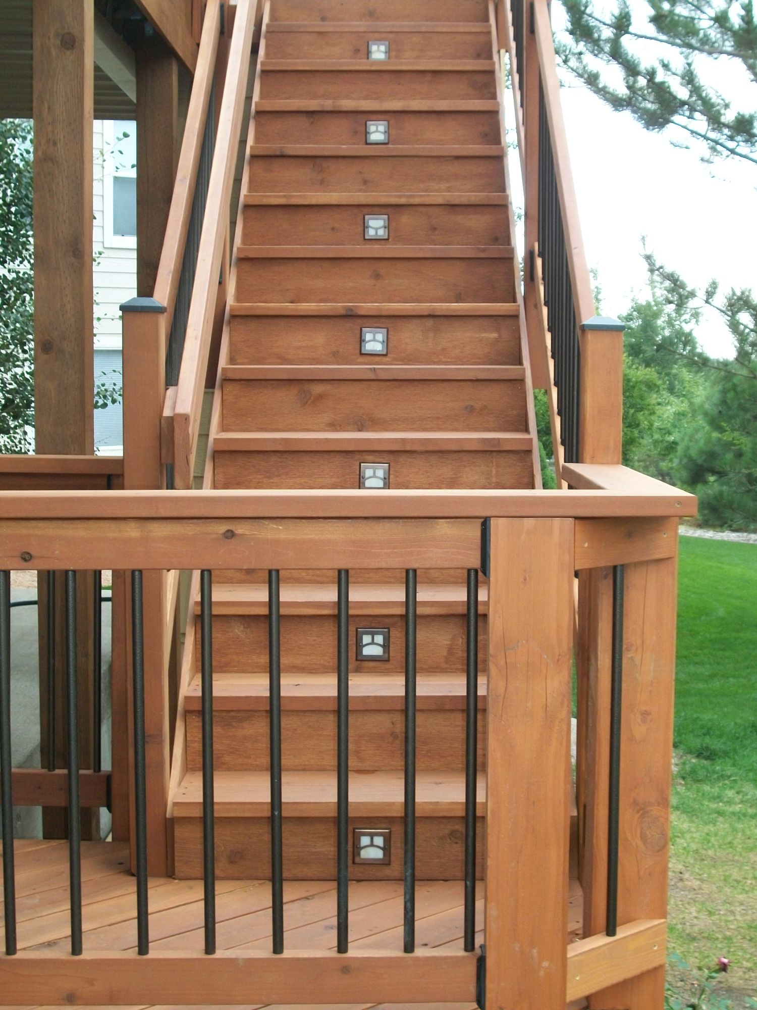 3'-wide closed deck stairs with a 90-degree turn landing. We installed Moab step lights for safety.