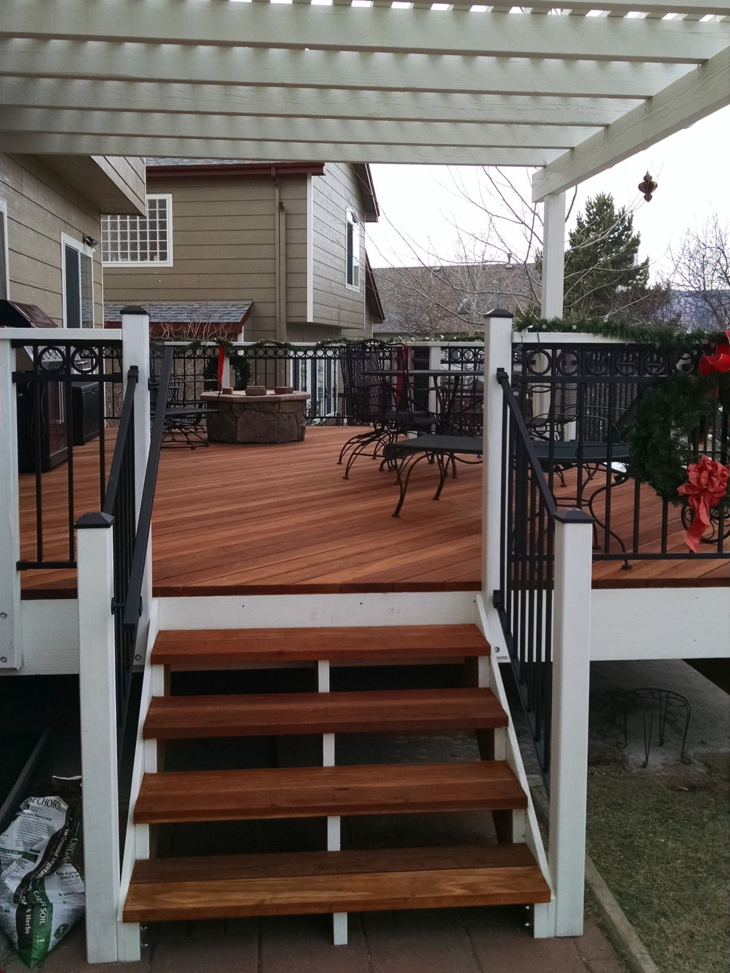 Redwood deck with 3'-wide open deck stairs.
