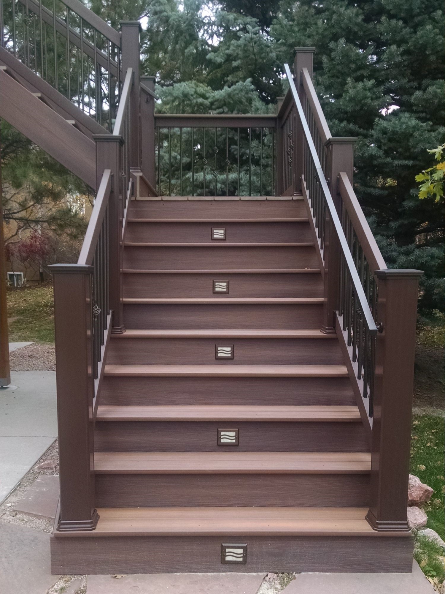 4' wide closed deck stairs with lights on the risers.