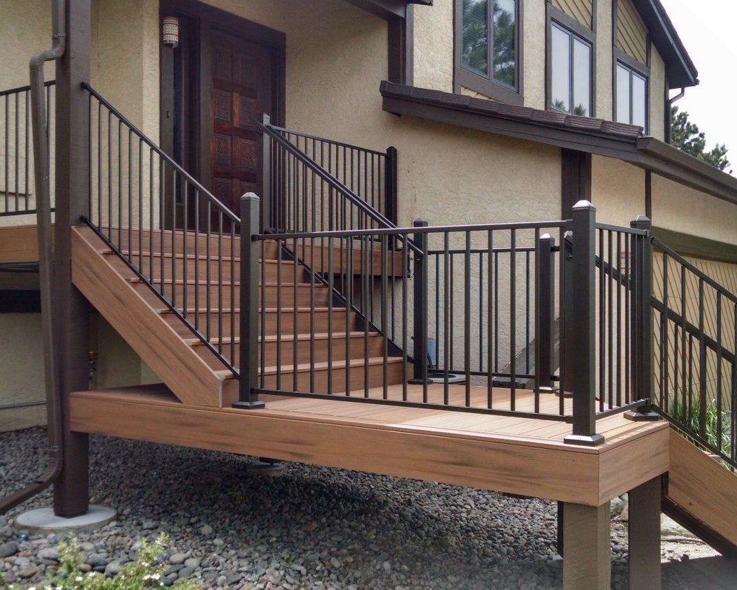 Entry-way featuring 5'-wide composite steps with a 45-degree turn landing leading to a driveway.