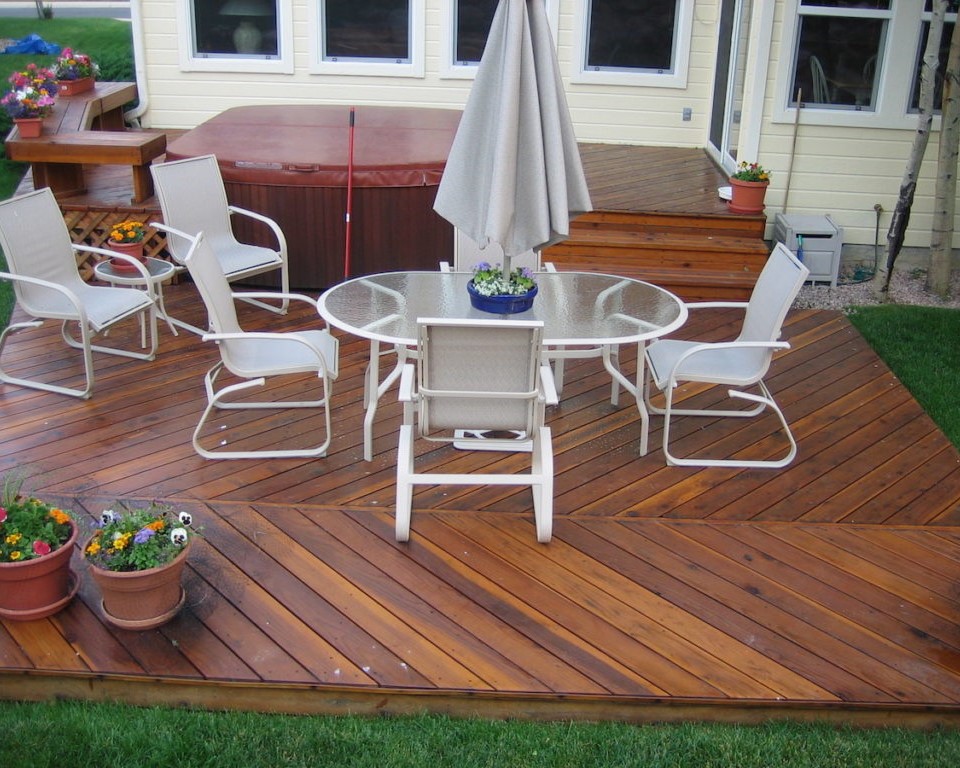 Gorgeous, ground-level Cedar deck in a herringbone pattern with no divider board.
