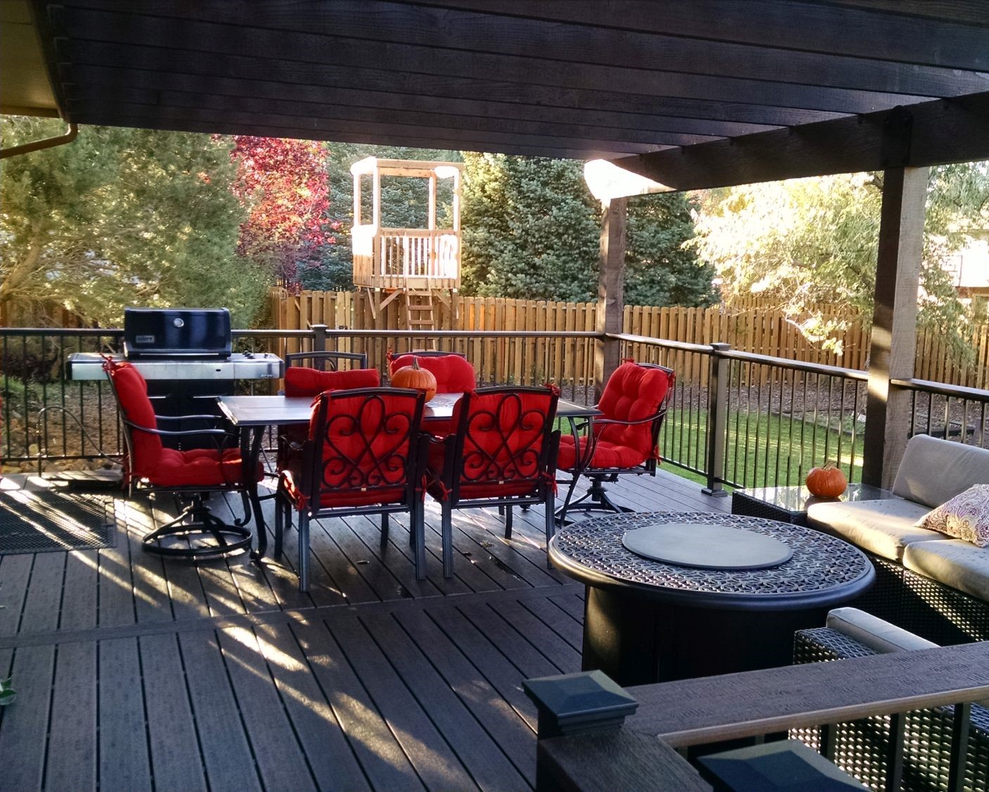 Composite deck with cedar pergola creates beautiful outdoor dining area