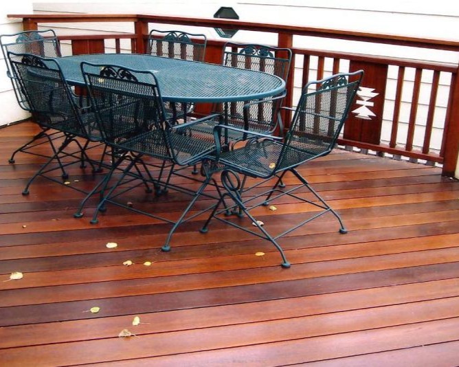 Cumaru hardwood deck with custom built wood railing featuring cut out panels.