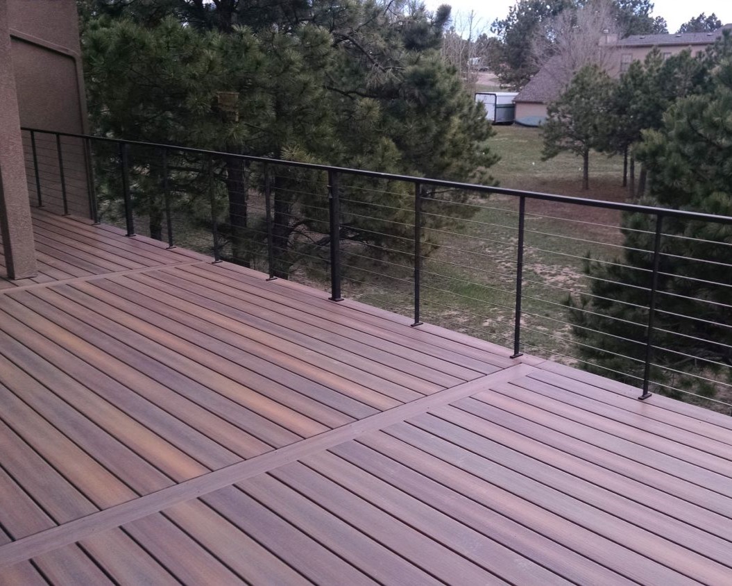 Composite deck with a custom metal and stainless steel cable railing.