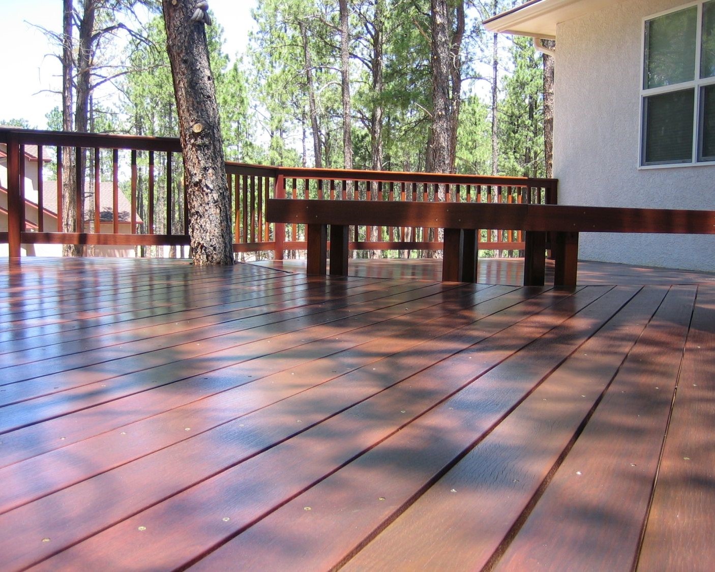 Hardwood deck built using Ipe wood. The railing and a custom bench were also built from Ipe.