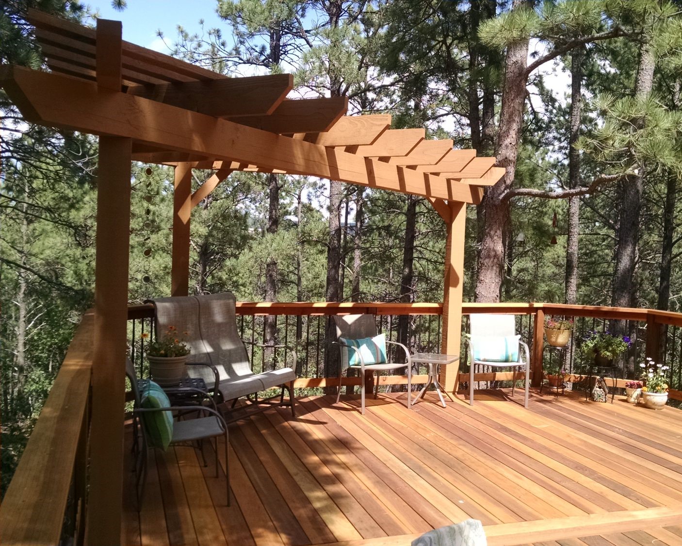 Wood deck built in the forest with B-Grade Redwood, tri-corner pergola in Cedar