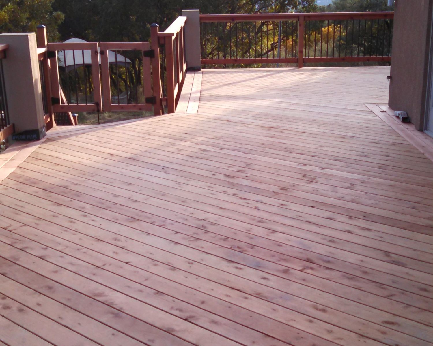 Heart Redwood deck, before it is stained, with the decking laid at 45-degrees and double picture frame board
