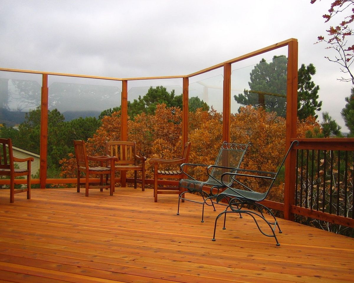 Glass windbreak on a redwood deck. Allows the gorgeous view of the hills to remain clear.