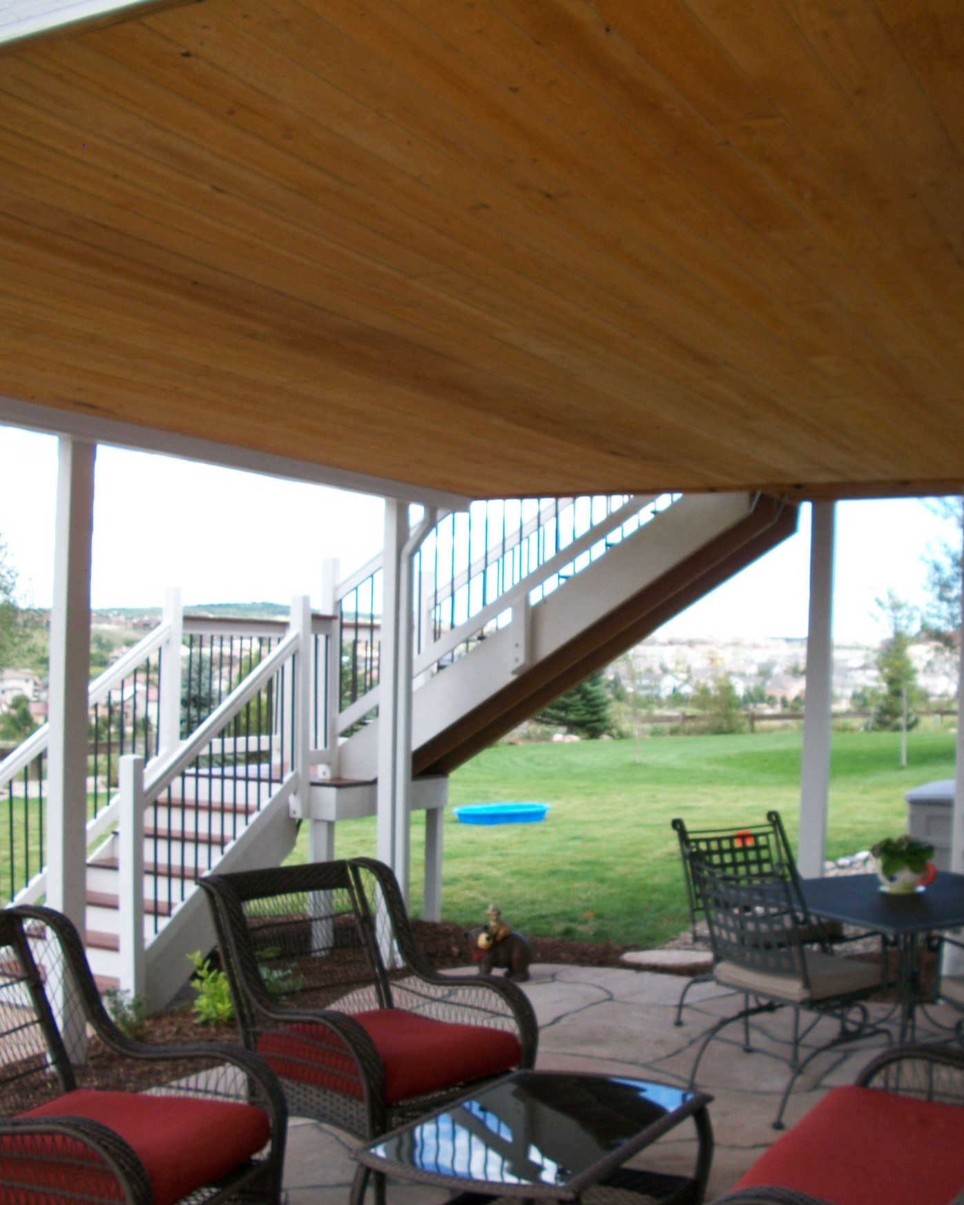 Hardwood deck built with an dry space below, creating a comfortable outdoor living space.