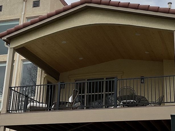 Covered deck with a vaulted, tongue and groove ceiling in Canadian Ice Lager from WoodTone