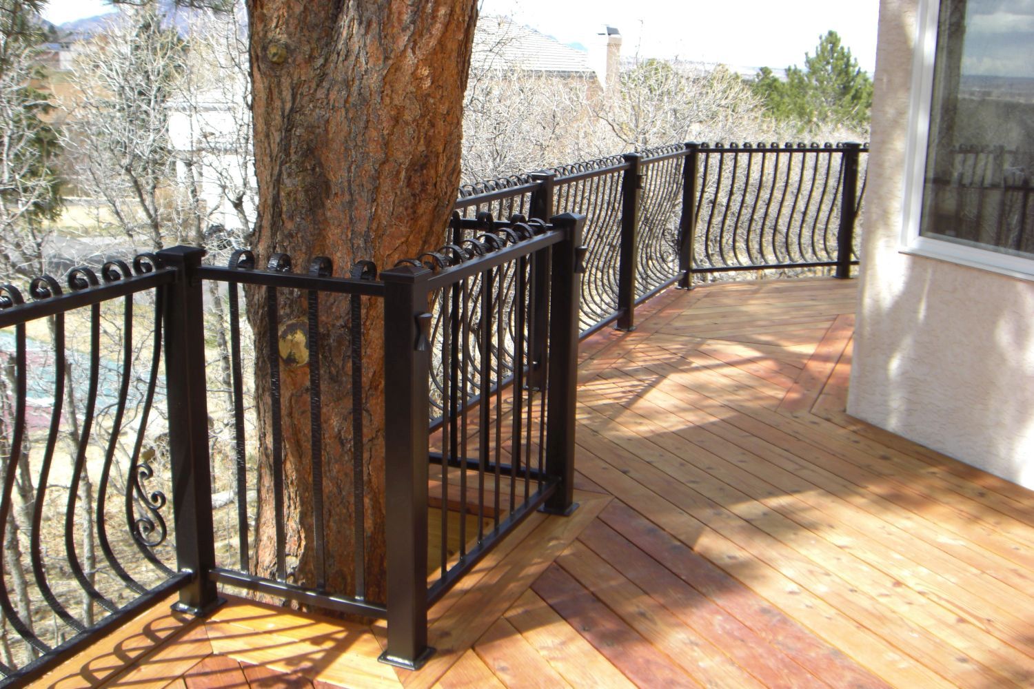 Heart Redwood deck (unstained) that was built to accommodate an existing shade tree.