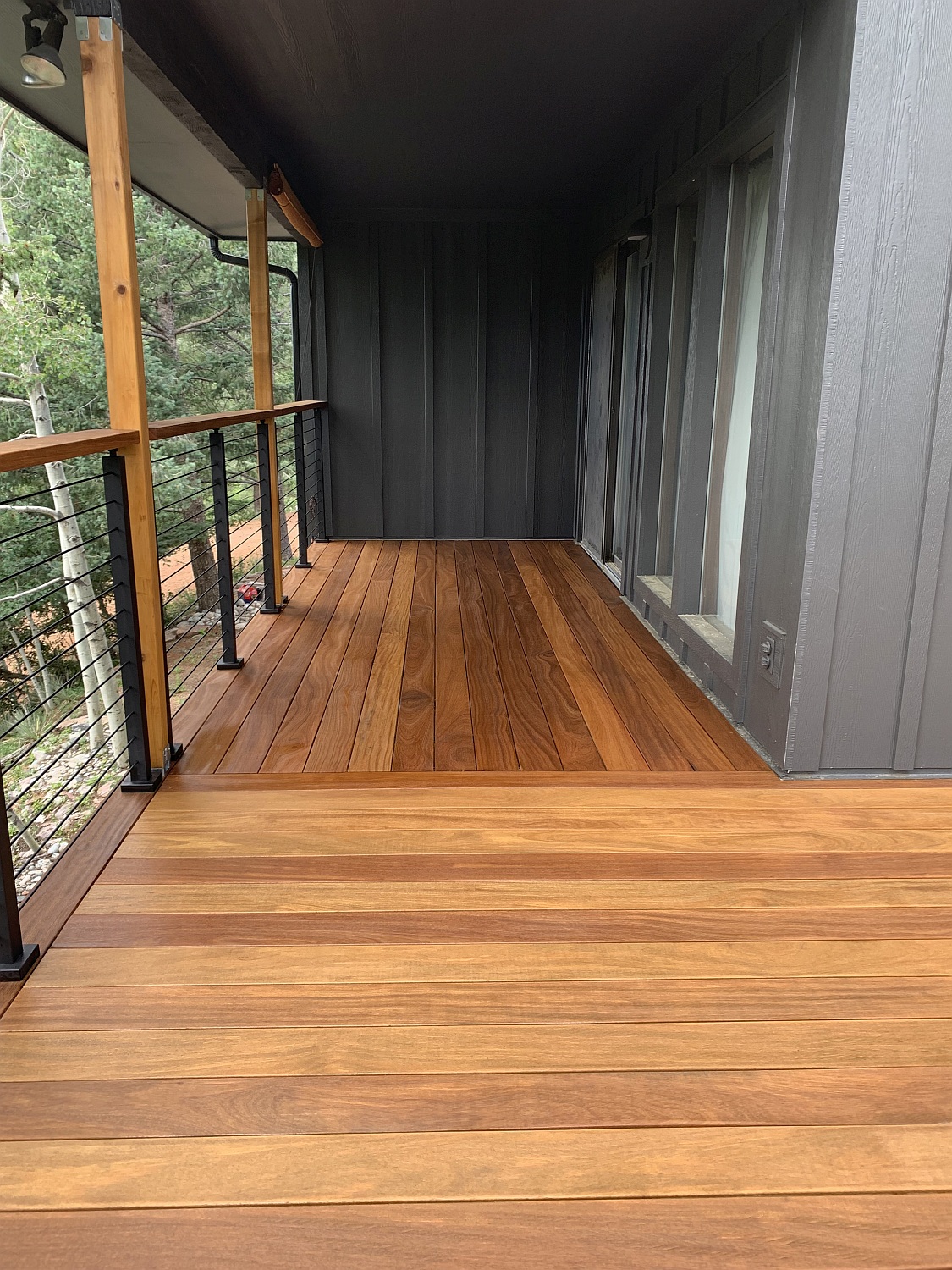 Gorgeous Cumaru hardwood deck stained with Ipe oil gives the wood a warm depth