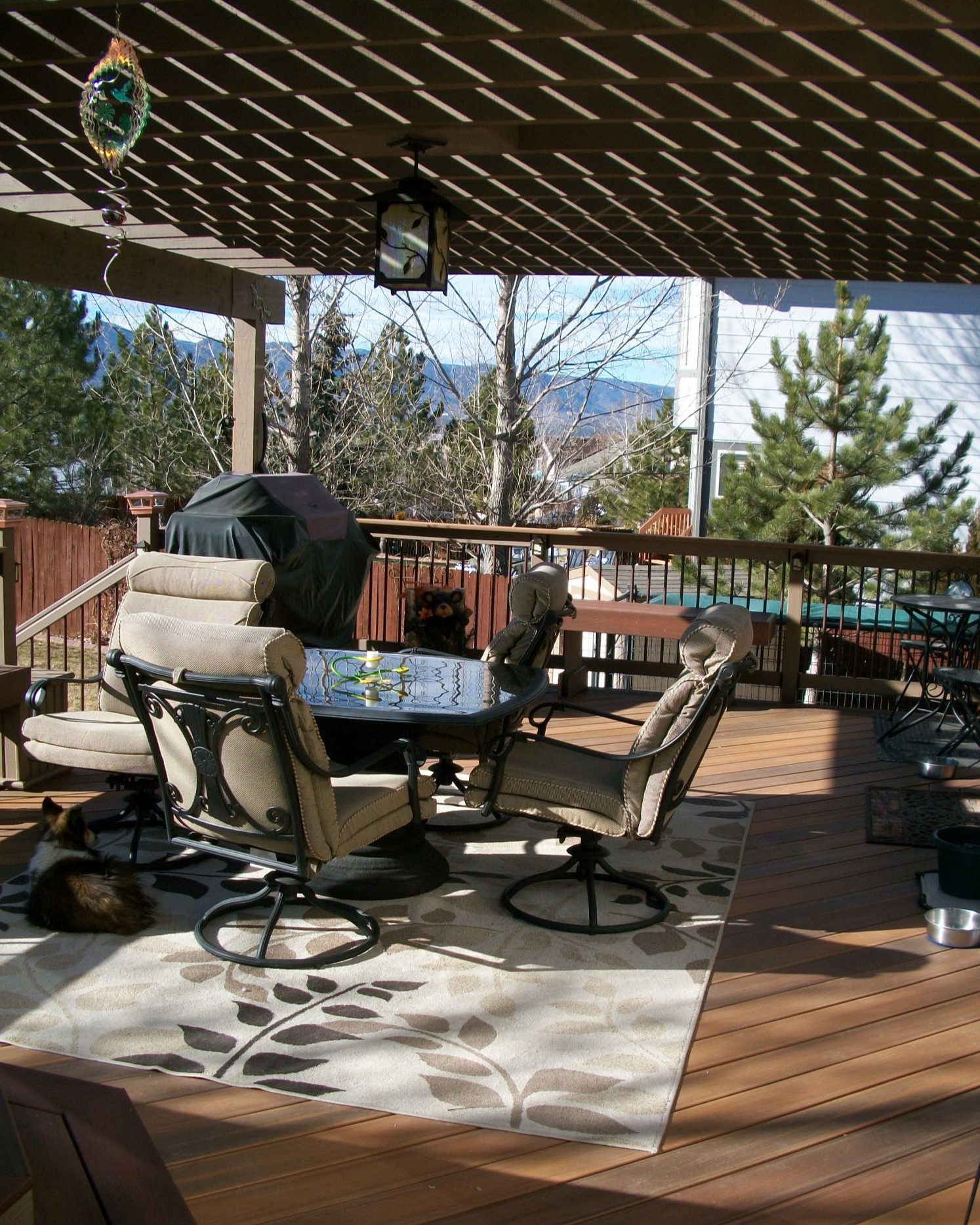 A composite deck with a pergola provides a beautiful, shaded seating area.