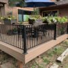 A gorgeous outdoor living space created with a composite deck. The homeowner has added a dining area and flower boxes along the railing.