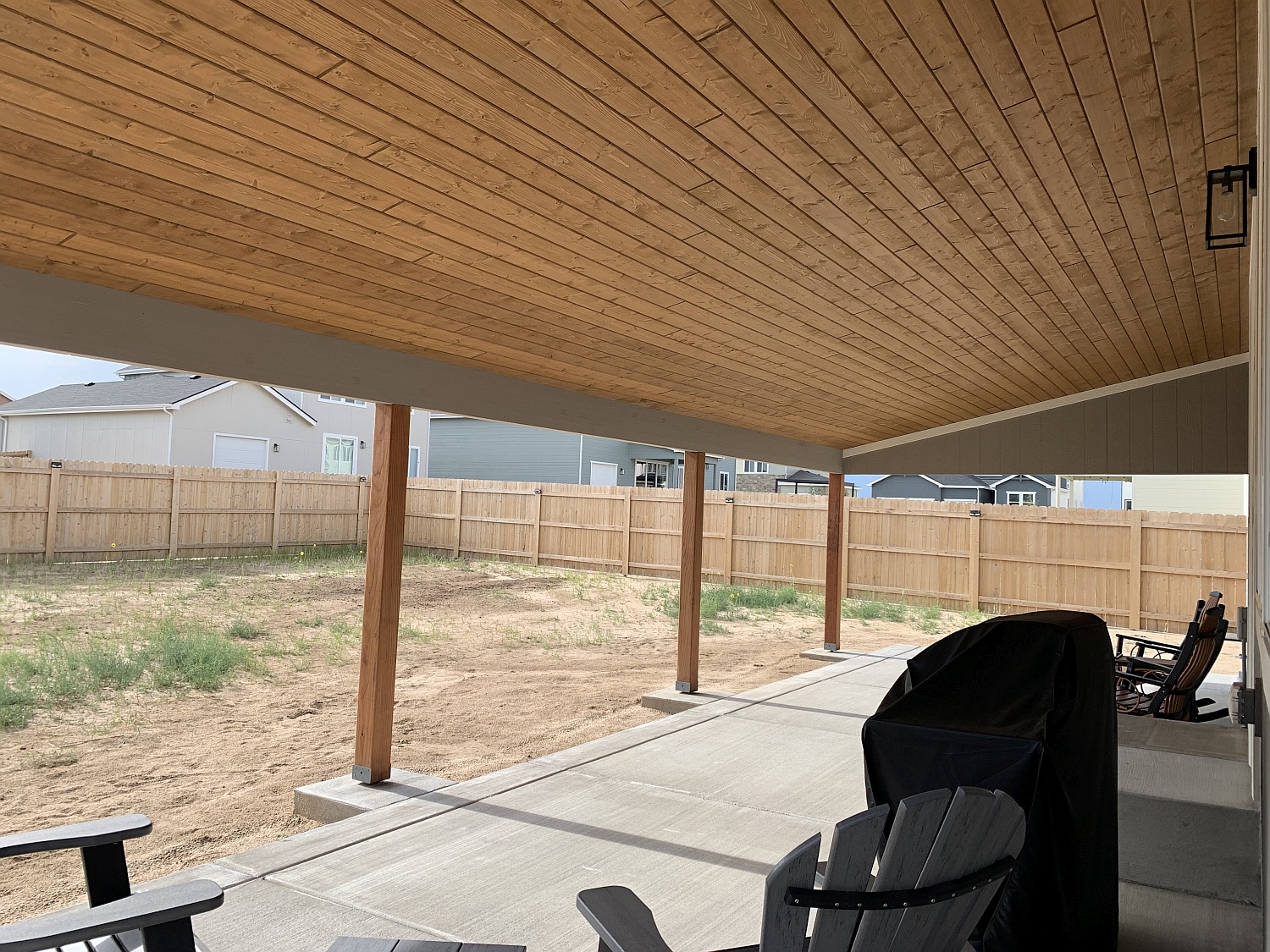Shed roof patio cover with a tongue and groove ceiling in Texas Honey Brown
