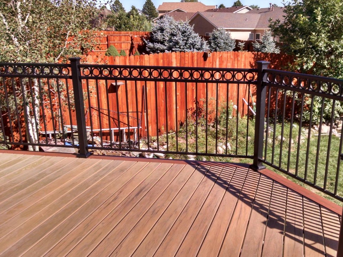 Fortress Fe26 black metal deck railing with top accent piece featuring circles