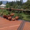 Redwood deck with herringbone design and double picture frame border and dividing boards in a darker contrasting color