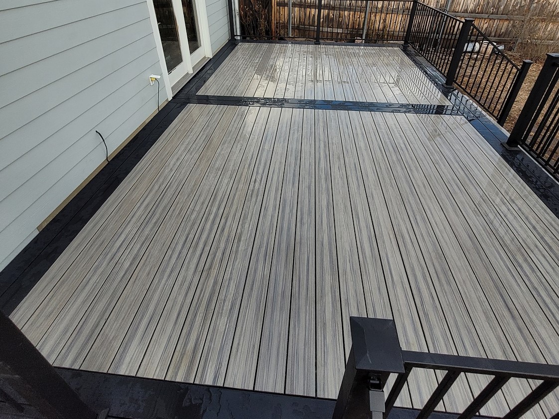 New composite deck with light grey decking and a double picture frame in dark grey to create a beautiful contrast